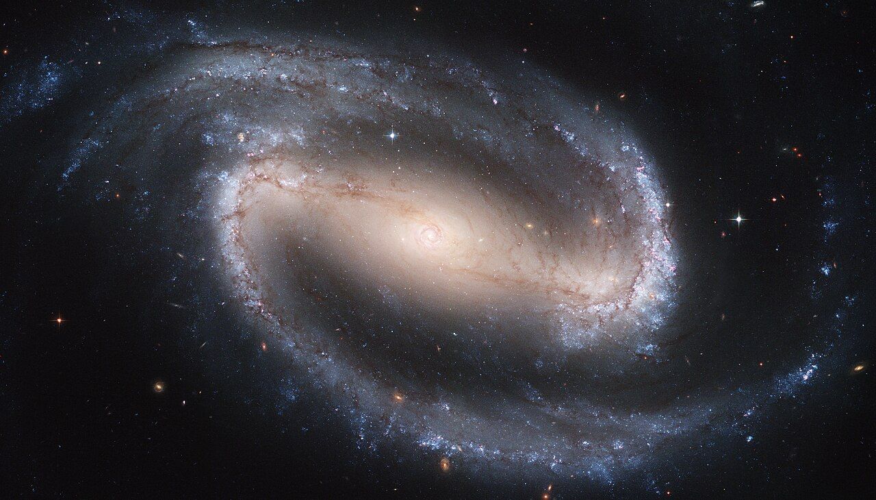 NGC 1300 — a barred spiral galaxy showing the central bar with spiral arms extending from both ends