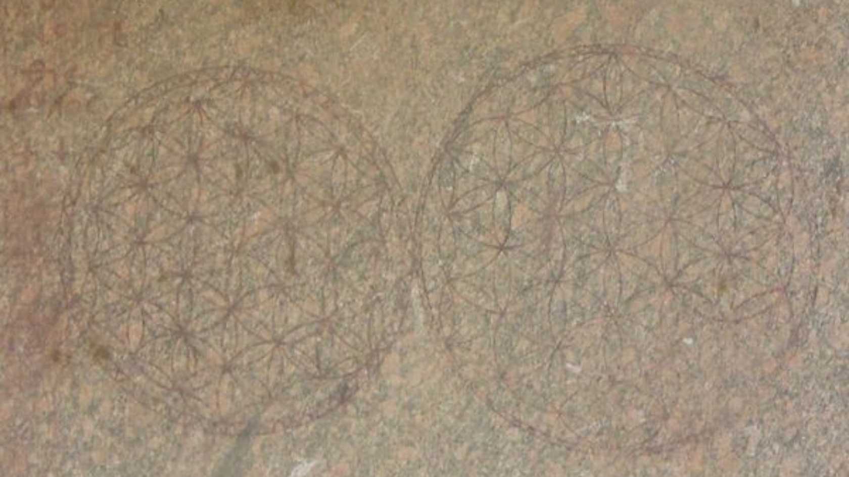 The Flower of Life inscribed in red ochre on a granite column at the Temple of Osiris at Abydos, Egypt