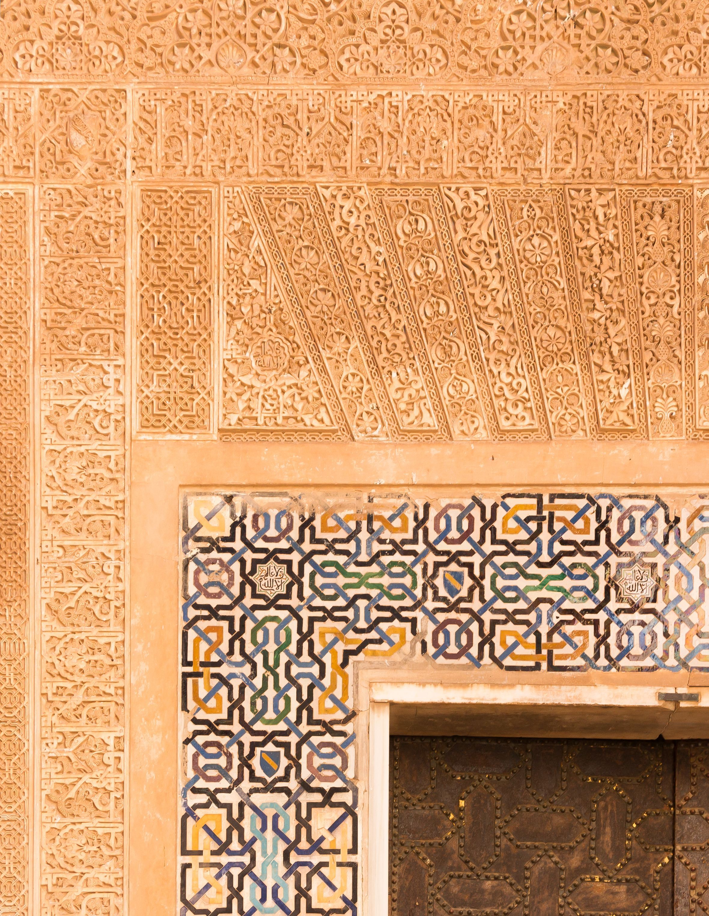 Nazari geometric ornaments in the Alhambra, Granada — interlocking octagonal and star patterns in tilework
